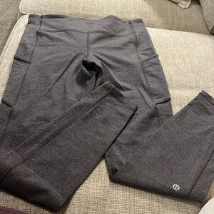 Lululemon size 8 Leggings w/pockets & back zipper. Practically new, hardly worn